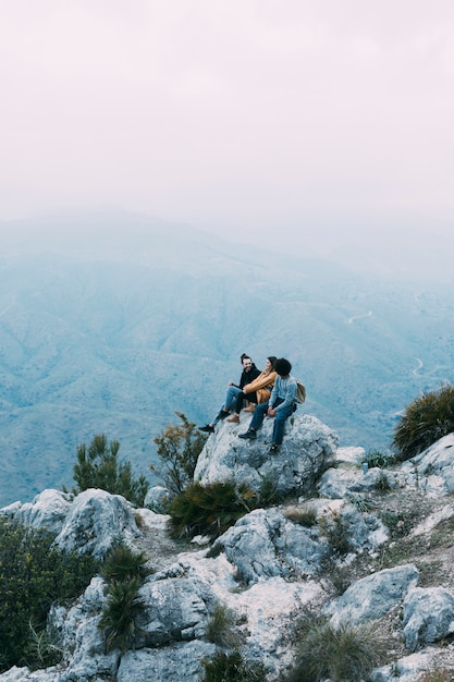 Group of hikers sitting on rock