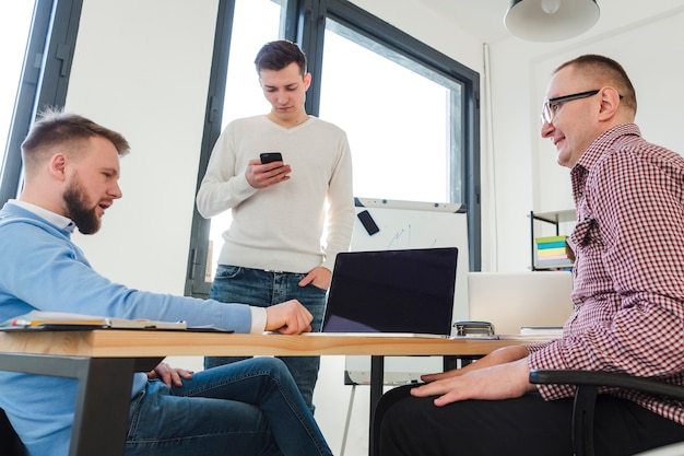 Group of men working together at the office