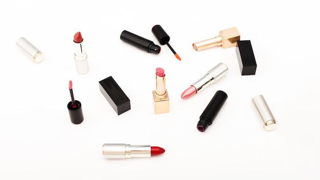 Free photo group of metallic lipsticks on white background