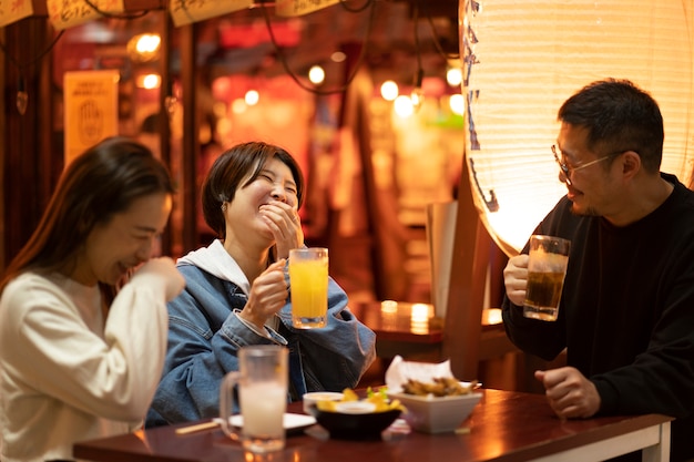 Group of middle age friends having fun at night