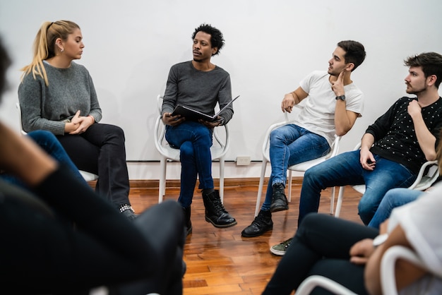 Group of multiethnic creative business people working on a project and having a brainstorming meeting. Team work and brainstorming concept.