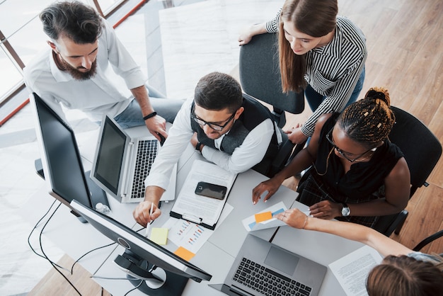 A group of multinational busy people working in the office.