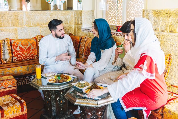 Group of muslim friends in restaurant