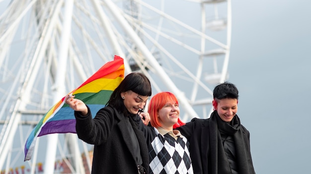 Free Photo group of non binary people with lgbt flag