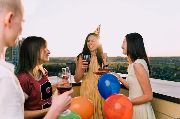 Group of people celebrating on the rooftop