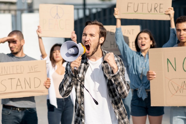 Free photo group of people demonstrating for peace