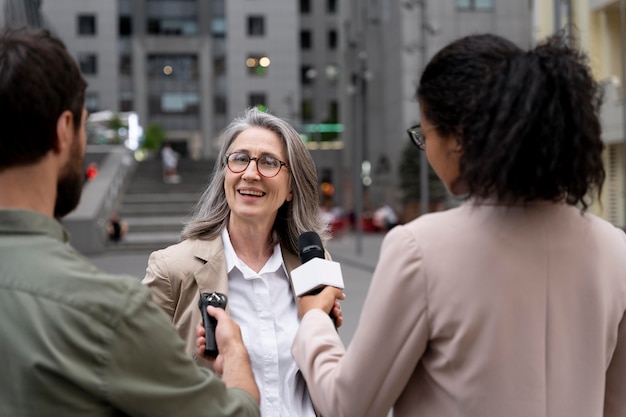 Group of people doing a journalism interview