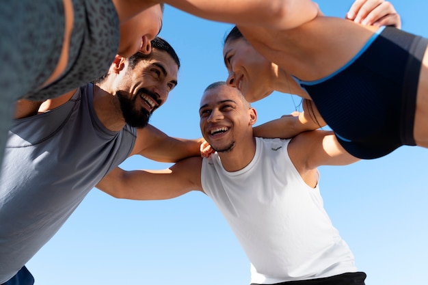 Free Photo group of people exercising together outdoors