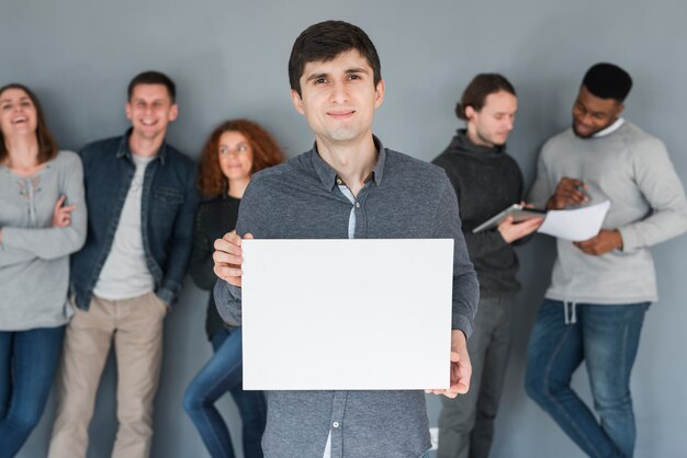 Group of people holding blank paper template