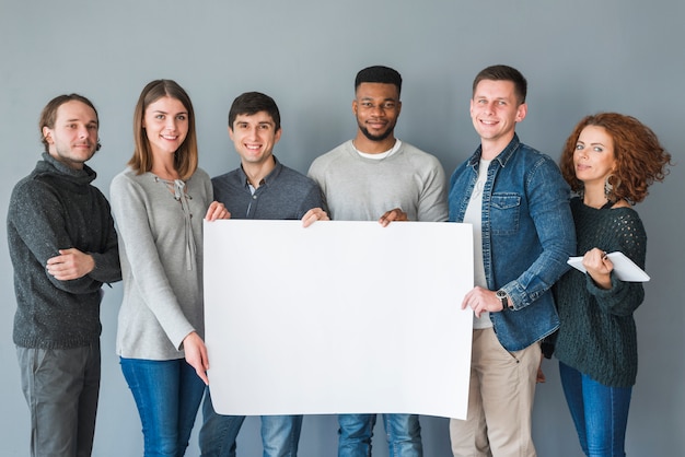 Group of people holding blank paper template