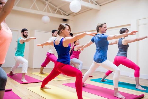 Group of people performing stretching exercise