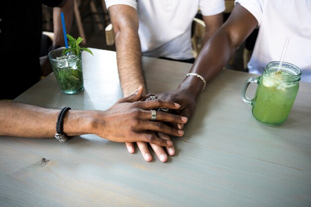 Group of people putting their hands together