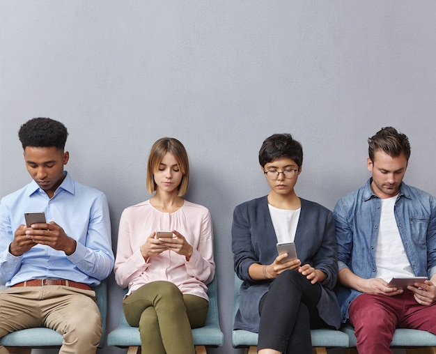 Group of people sitting in waiting room