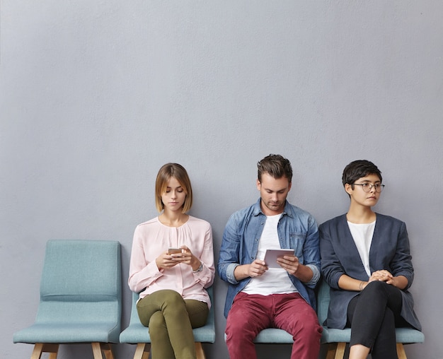 Free Photo group of people sitting in waiting room