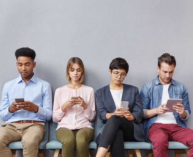 Group of people sitting in waiting room