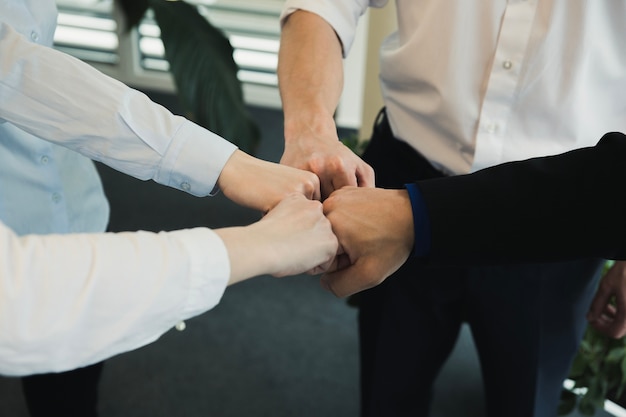 Free photo group of people stacking hands