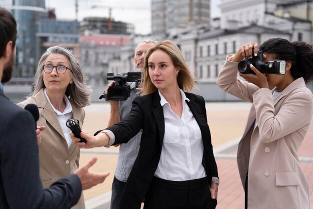 Group of people taking an interview for the news