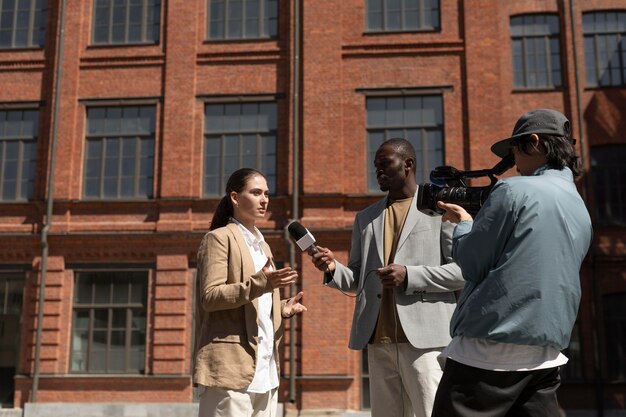 Group of people taking an interview outdoors