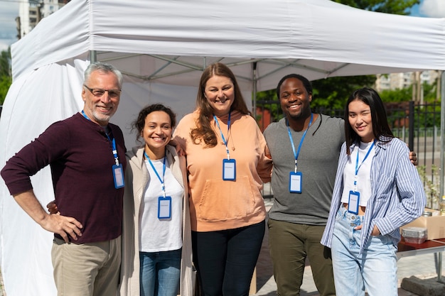 Group of people volunteering at a foodbank for poor people