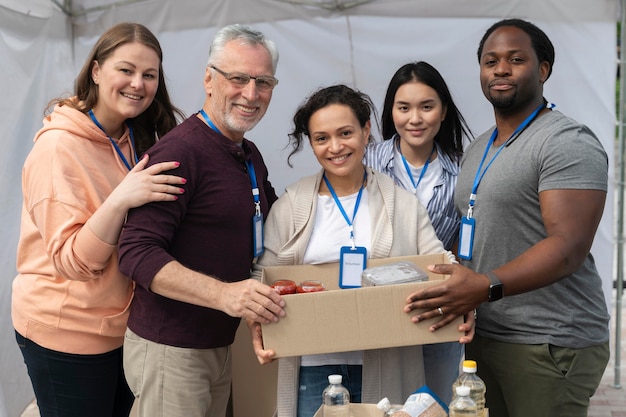 Free photo group of people volunteering at a foodbank for poor people