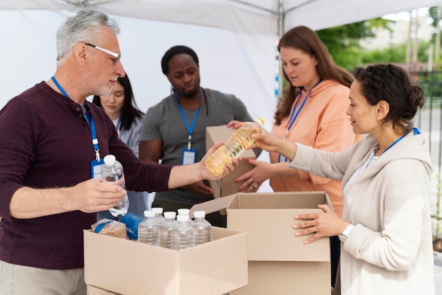 Free Photo group of people volunteering at a foodbank