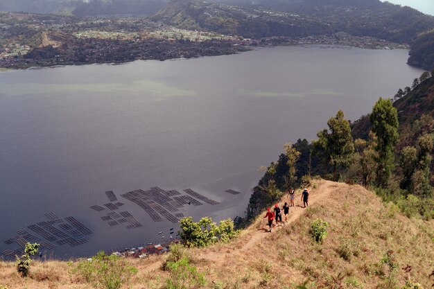 A group of people walking on the trek. bali