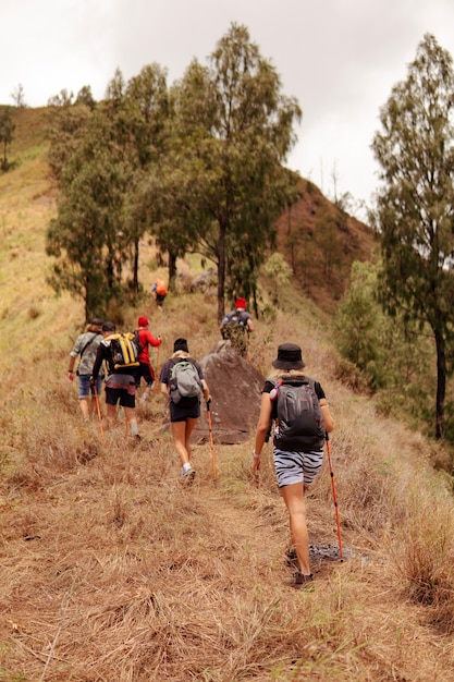 Free Photo a group of people walking on the trek. bali