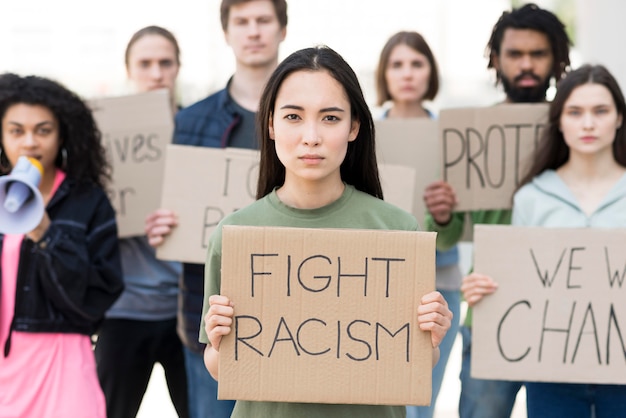 Free photo group of people with fight racism quotes