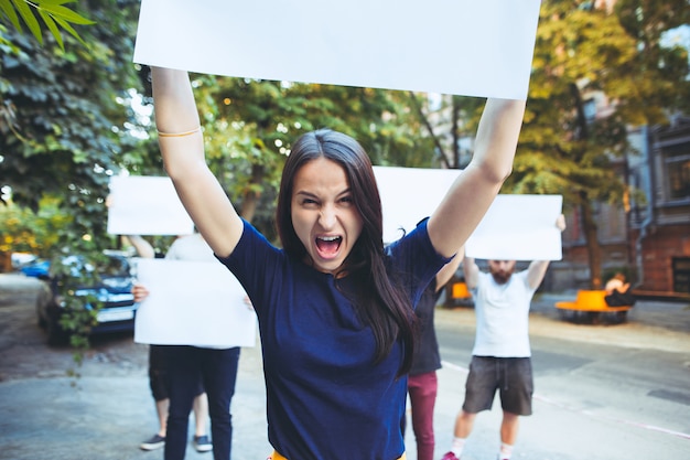 Group of protesting young people outdoors