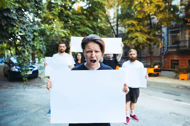 Free photo group of protesting young people outdoors