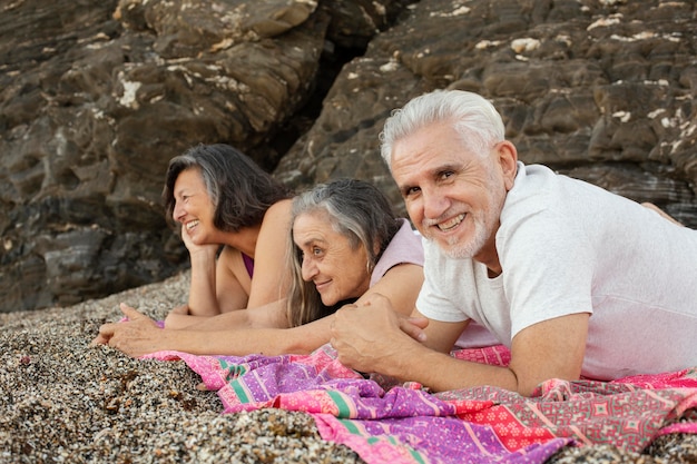 Group of senior friends enjoying their day at the beach