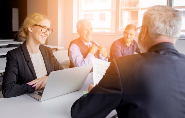 Free photo group of successful business team at workplace