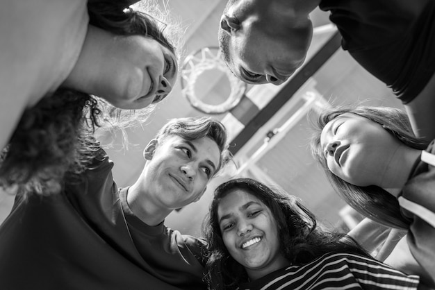 Free photo group of teenager friends on a basketball court teamwork and togetherness concept