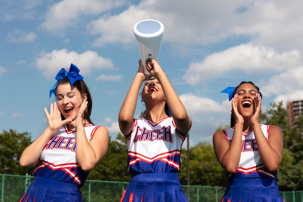 Group of teenagers in cheerleader uniforms