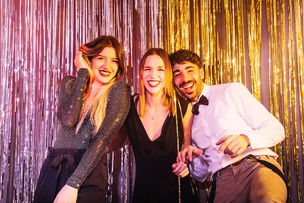 Group of three friends celebrating 2018