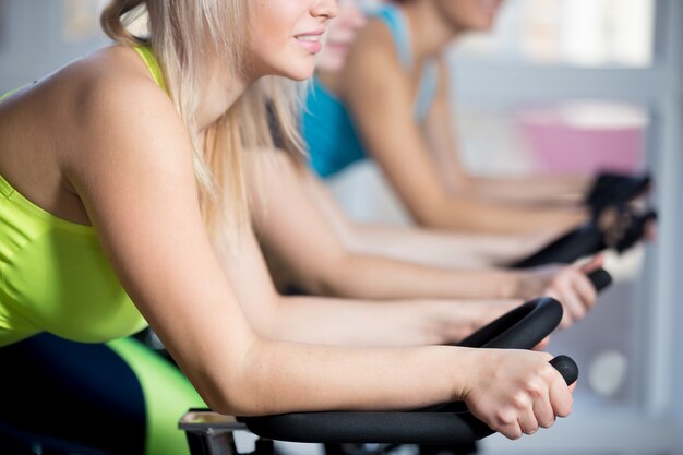 Group of women doing cycling cardio training