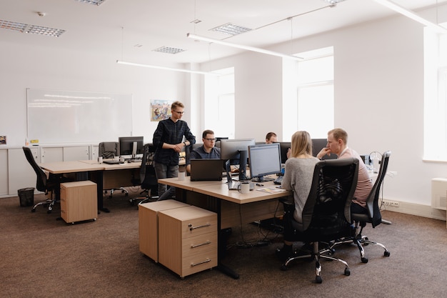 Group of young business people working in the office