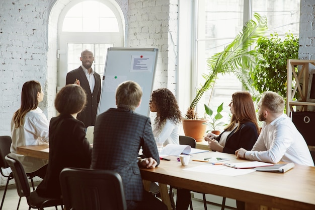 Group of young business professionals having a meeting, creative office