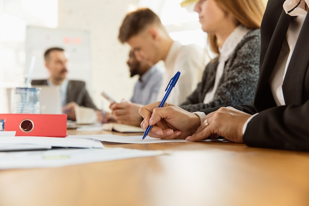 Group of young business professionals having a meeting, creative office