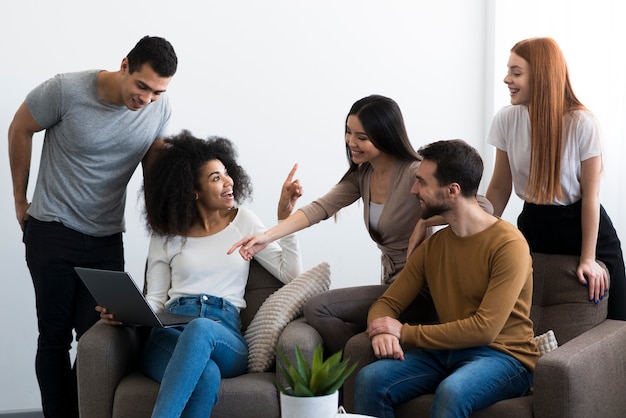 Group of young friends gathering together