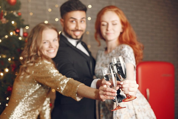 Free Photo group of young people celebrating new year. women with indian man.