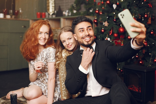 Free Photo group of young people celebrating new year. women with indian man.