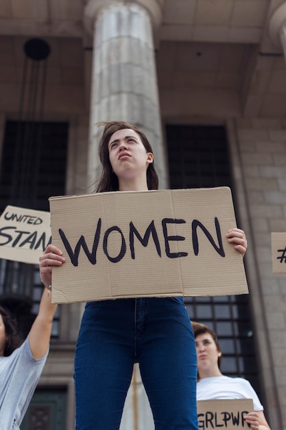 Free photo group of young women marching for equal rights