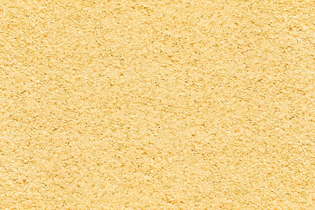 Grunge yellow surface. Rough background textured .