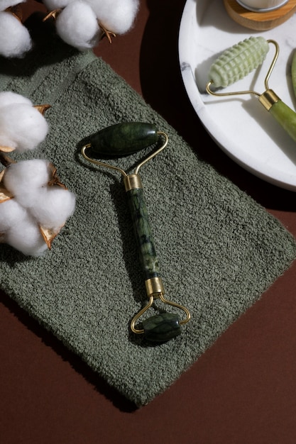 Gua sha and cotton arrangement flat lay