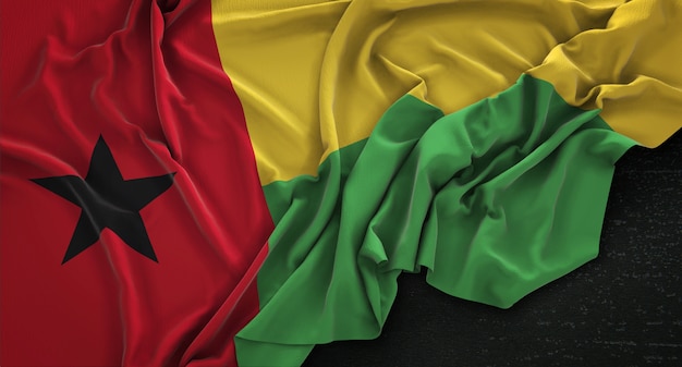 Free photo guinea-bissau flag wrinkled on dark background 3d render