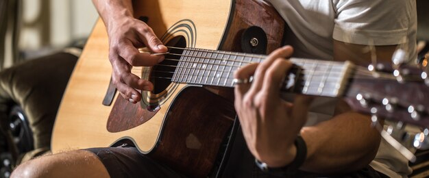 guy playing the acoustic guitar