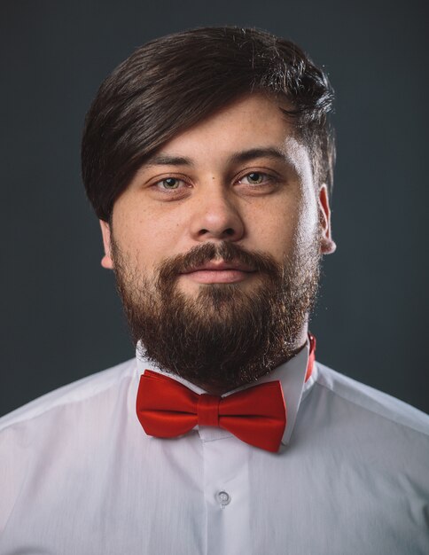 Guy in a white shirt with red tie bow