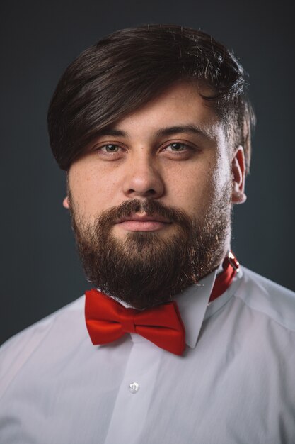 Guy in a white shirt with red tie bow