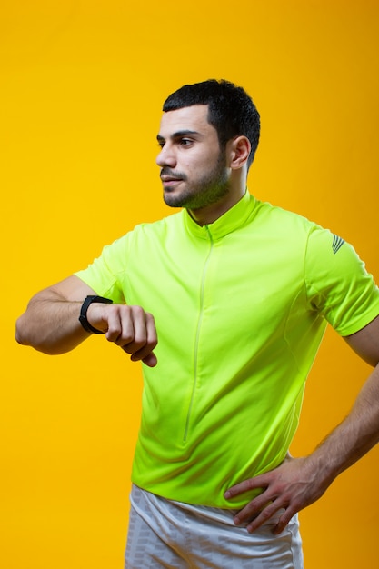 Guy in yellow t shirt posing on camera